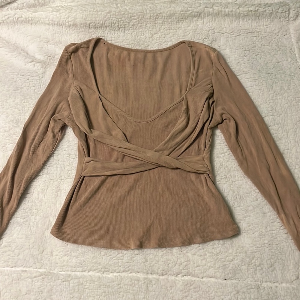 Tan cross-cross top.